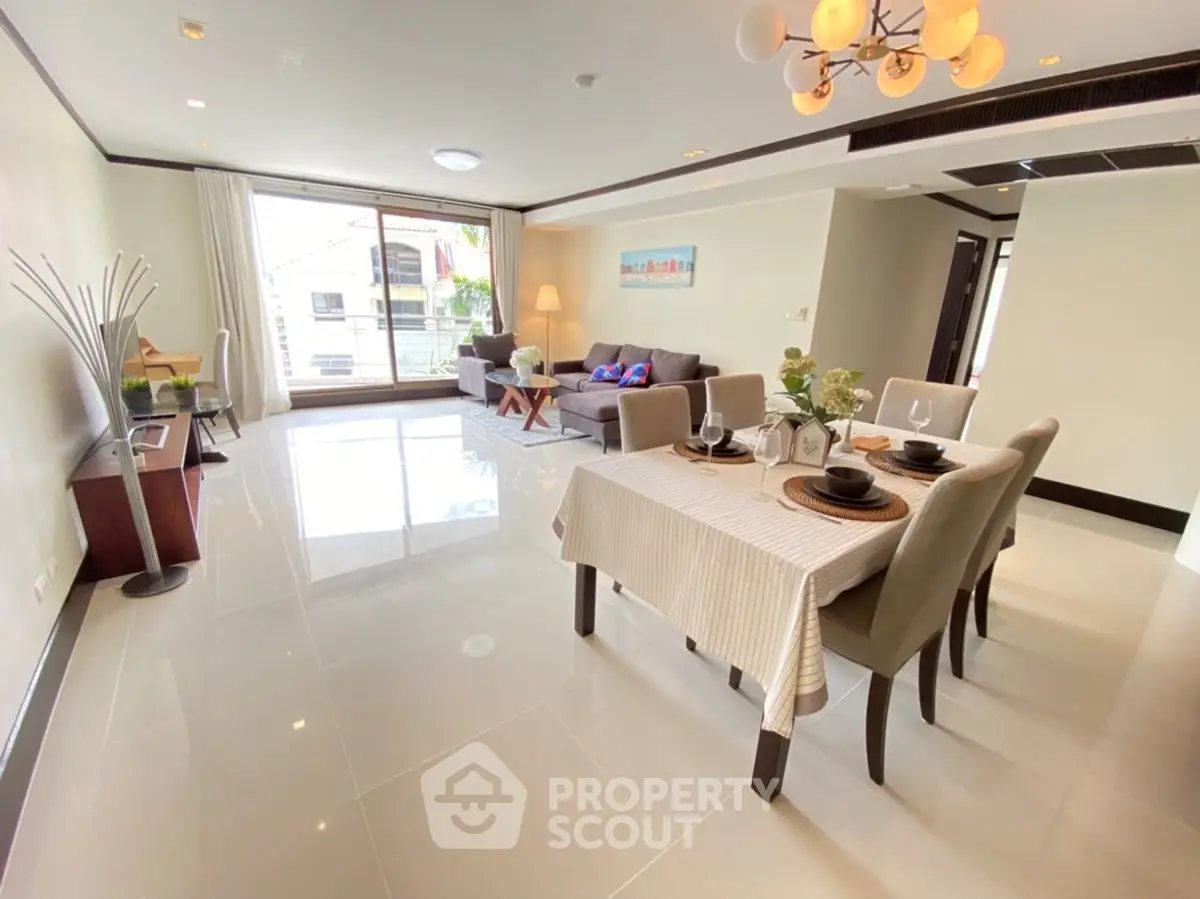 Spacious modern living and dining area with elegant decor and natural light.