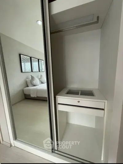 Modern bedroom with sleek built-in wardrobe and stylish decor