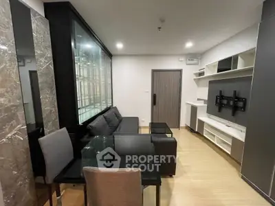 Modern living room with sleek furniture and stylish decor in a contemporary apartment.