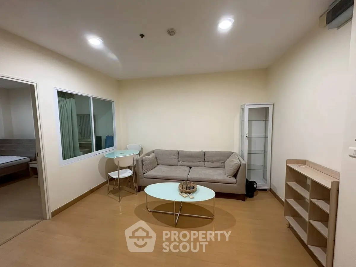 Spacious living room with modern furniture and wooden flooring