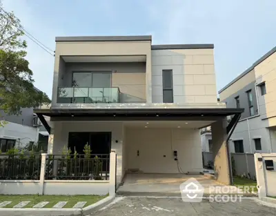 Modern two-story house with sleek design and spacious driveway