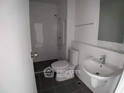 Modern minimalist bathroom with sleek fixtures and contemporary design.