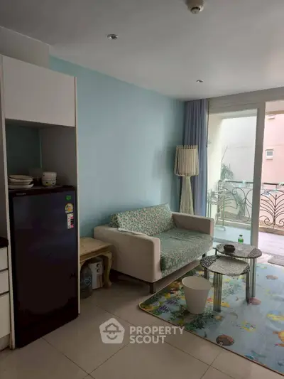 Cozy living room with balcony access in modern apartment