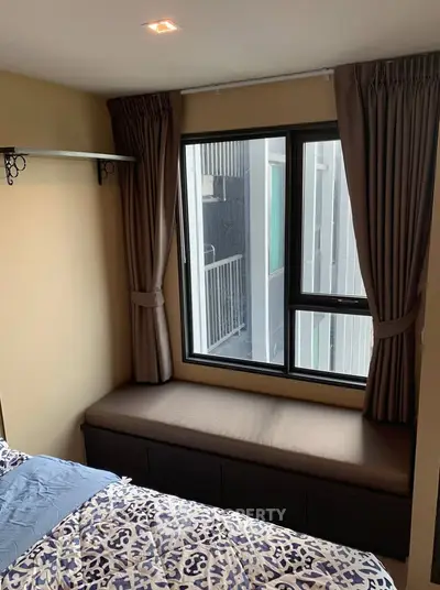 Cozy bedroom with window seat and modern decor