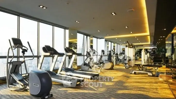 Luxurious high-rise gym with panoramic city views and modern fitness equipment.