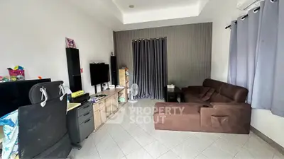Spacious living room with modern decor and comfortable seating