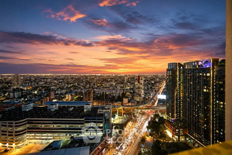 Stunning cityscape view from high-rise building at sunset, showcasing vibrant urban life and skyline.