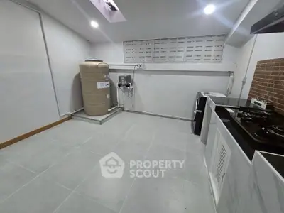 Spacious kitchen with modern appliances and ample storage space