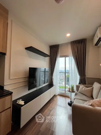 Modern living room with city view, sleek TV setup, and cozy sofa
