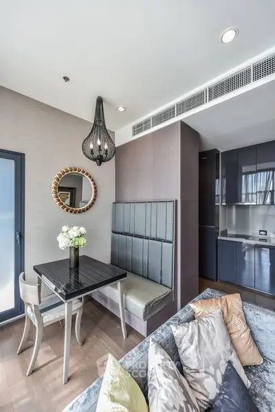Modern living room with stylish dining area and elegant decor in a contemporary apartment.
