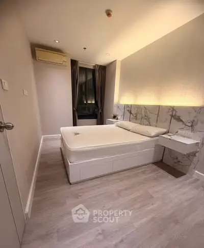 Modern bedroom with elegant lighting and minimalist design