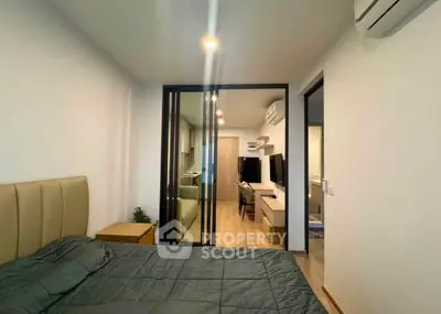 Modern bedroom with glass partition and sleek interior design