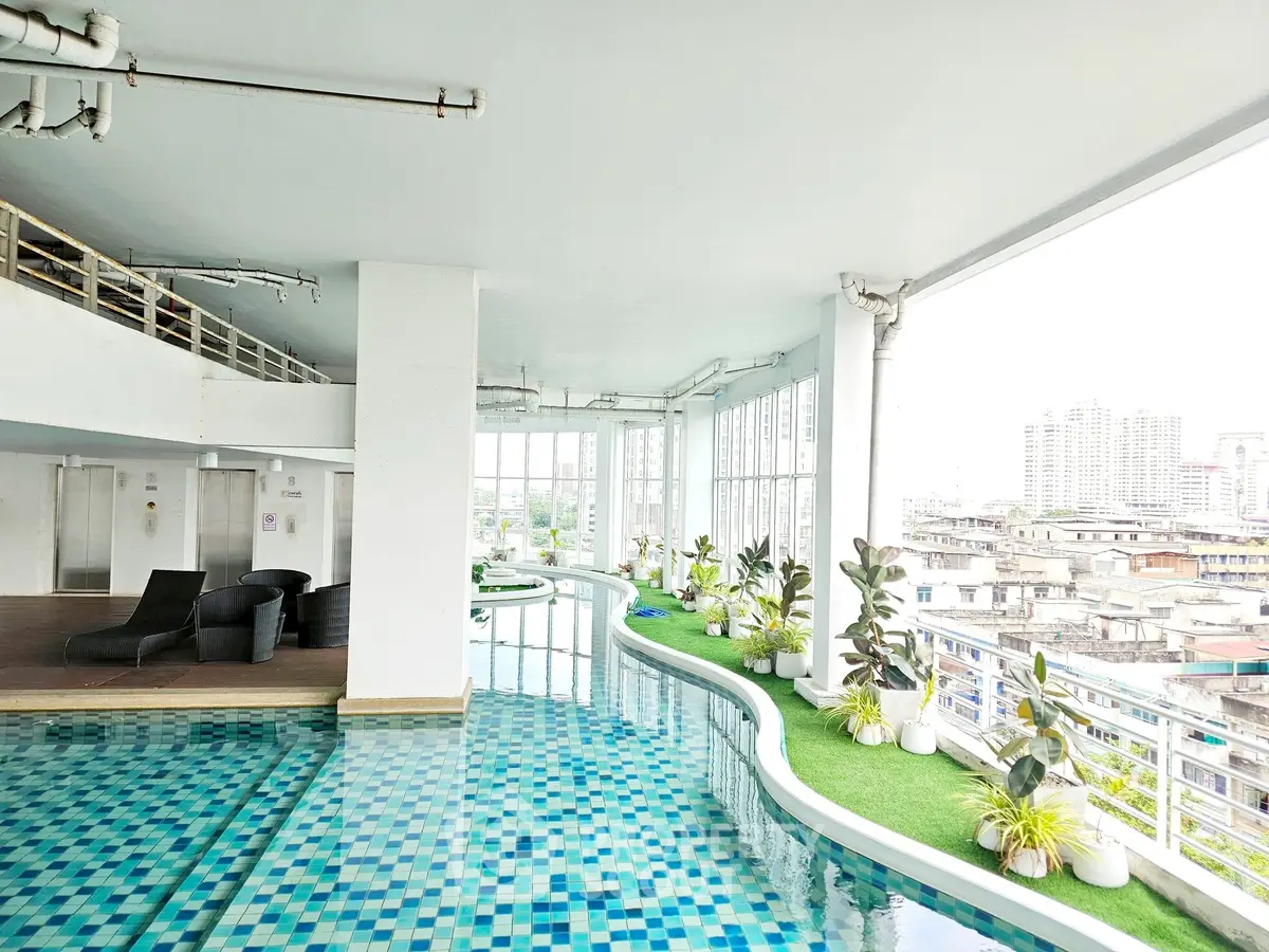 Luxurious indoor pool with panoramic city views and modern design