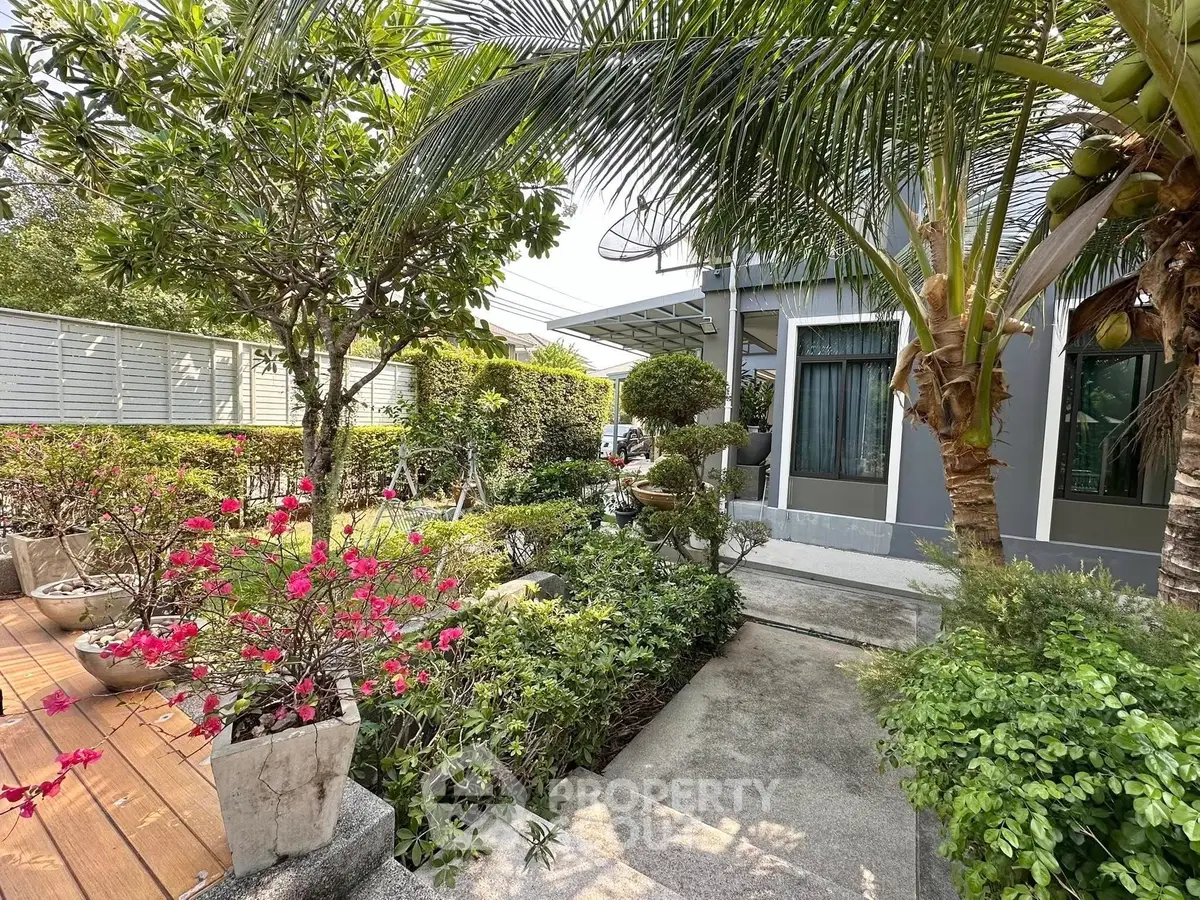 Charming garden view of modern home with lush greenery and vibrant flowers