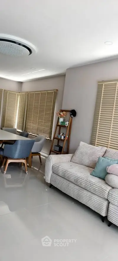 Modern living room with stylish furniture and natural light