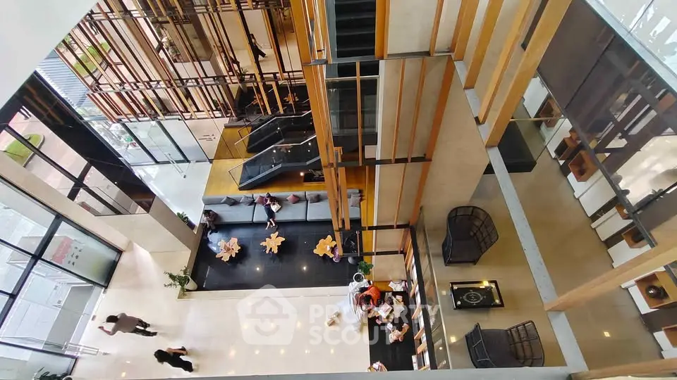 Luxurious modern building lobby with stylish seating and elegant design elements.