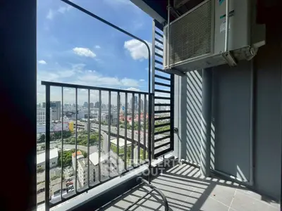 Stunning city view from a modern balcony with air conditioning unit