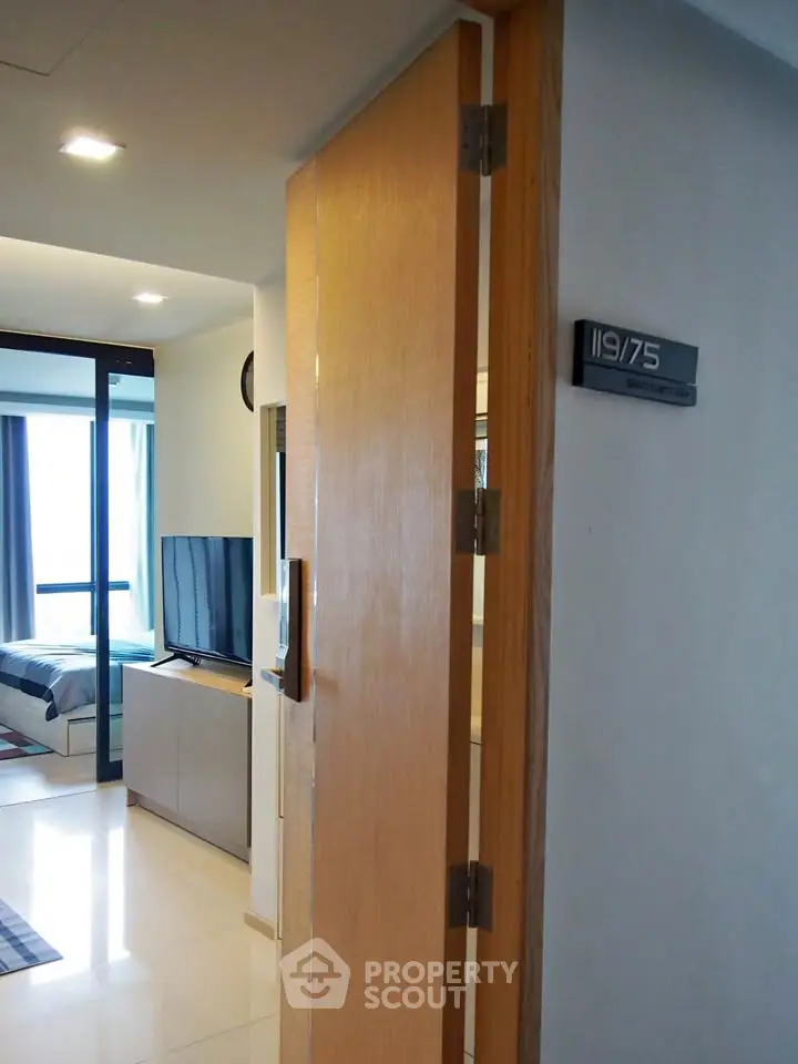 Modern apartment entrance with sleek interior and natural light