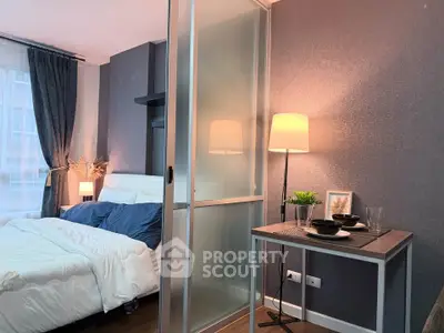 Modern bedroom with cozy decor and stylish lighting in a contemporary apartment.