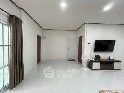 Spacious living room with modern decor and natural light