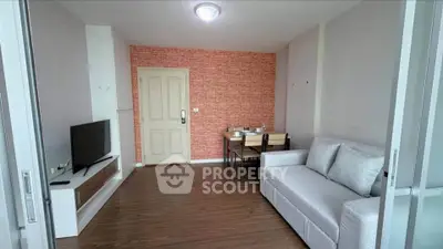 Modern living room with stylish decor and cozy seating area, perfect for relaxation and entertainment.