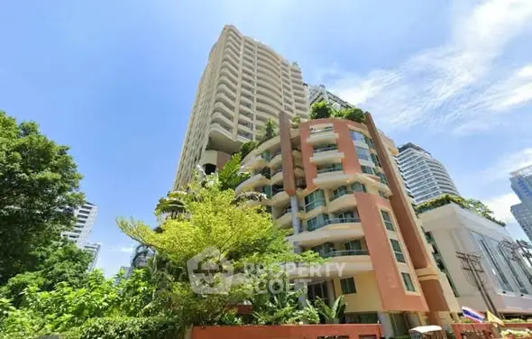 Stunning high-rise building with lush greenery and modern architecture in a prime urban location.