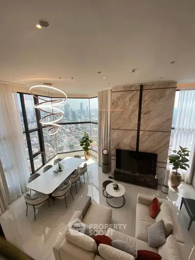 Luxurious high-rise living room with panoramic city views and modern decor.