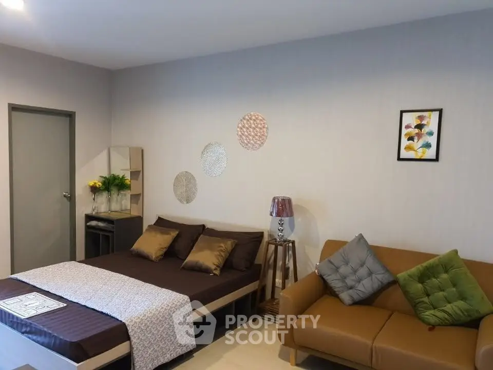 Modern bedroom with stylish decor and cozy seating area