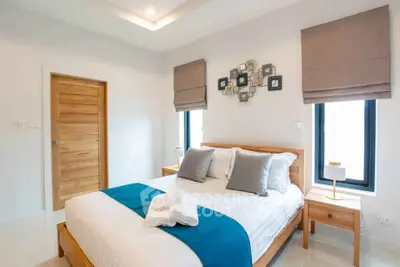Modern bedroom with stylish decor and natural light