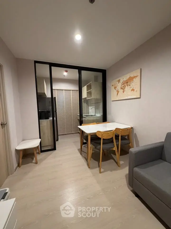 Modern living room with dining area and stylish decor in a cozy apartment.