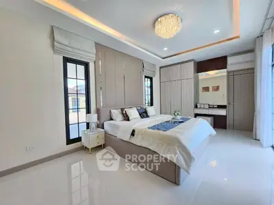 Luxurious bedroom with modern design and elegant chandelier