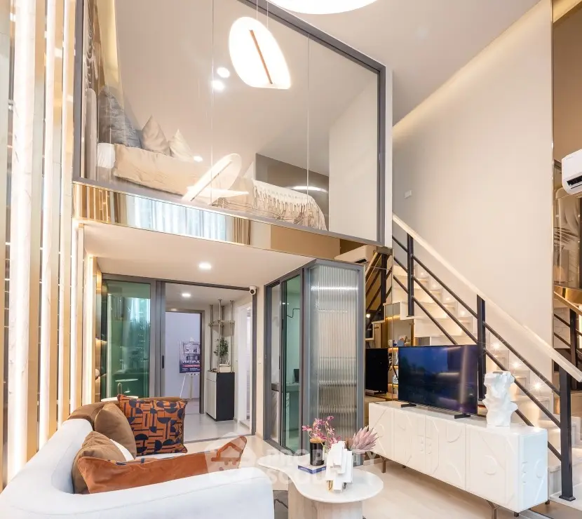 Modern loft apartment with stylish mezzanine bedroom and chic living area