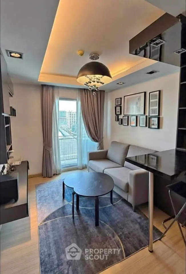 Modern living room with stylish decor and city view balcony