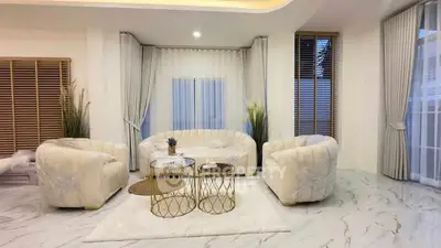 Luxurious modern living room with elegant marble flooring and plush seating