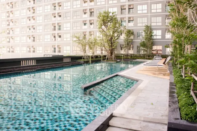 Luxurious condominium with stunning outdoor pool and lush greenery