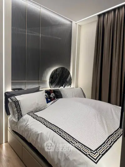 Luxurious modern bedroom with elegant bedding and ambient lighting