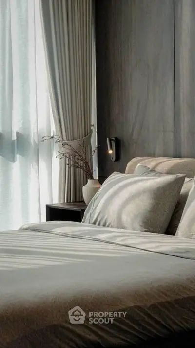 Luxurious bedroom with elegant decor and natural light