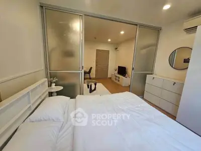 Modern bedroom with sliding glass doors and minimalist decor