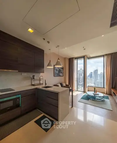 Modern open-layout kitchen and living room with stunning city view