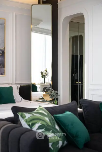 Luxurious living room with elegant decor and plush seating in modern apartment.