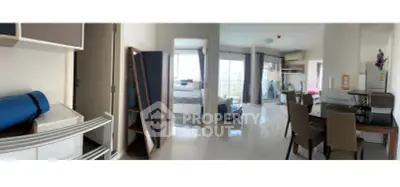 Spacious modern apartment with open layout, featuring a bright living area and cozy bedroom.