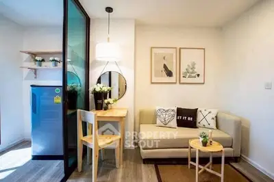 Charming compact living room with modern decor and cozy seating area, perfect for urban living.