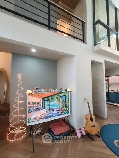 Modern living room with high ceilings, stylish decor, and natural light