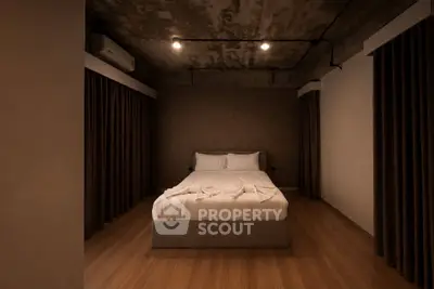 Modern minimalist bedroom with cozy lighting and wooden flooring