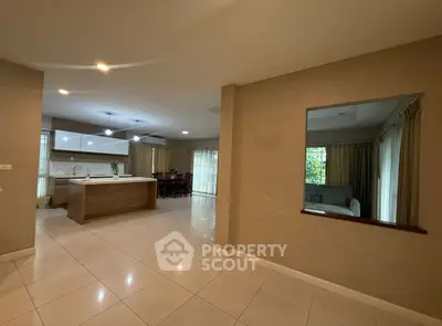 Spacious open layout kitchen and living area with modern design and ample natural light.