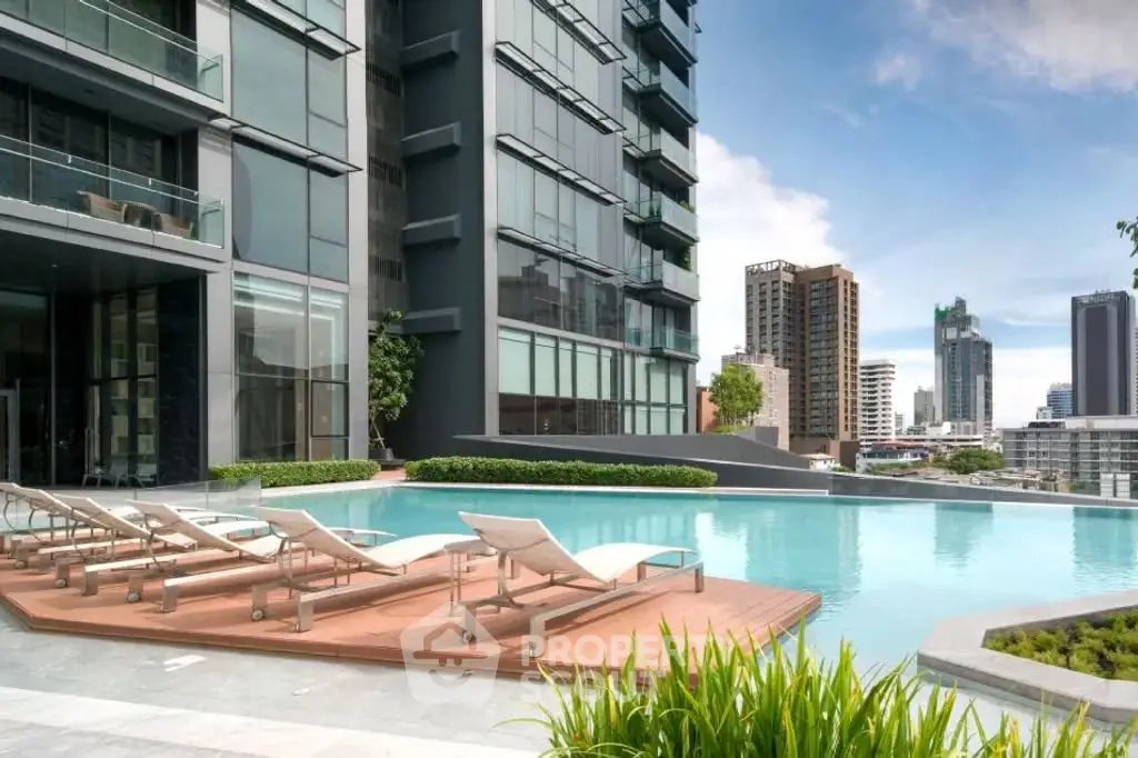 Luxurious high-rise building with stunning rooftop pool and city views, perfect for urban living.