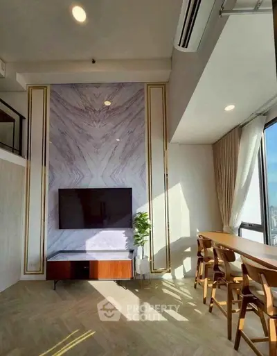 Luxurious living room with modern decor and stunning city view, featuring a sleek TV setup and elegant dining area.