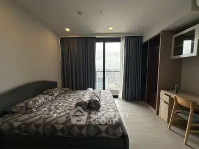 Modern bedroom with city view and stylish furnishings