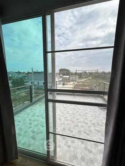 Spacious balcony with panoramic view, perfect for relaxation and enjoying the outdoors.