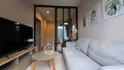 Modern living room with sleek furniture and stylish decor in a contemporary apartment.